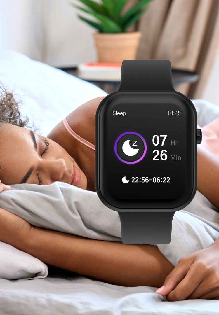 Person lying in bed with a smartwatch displaying sleep tracking information.